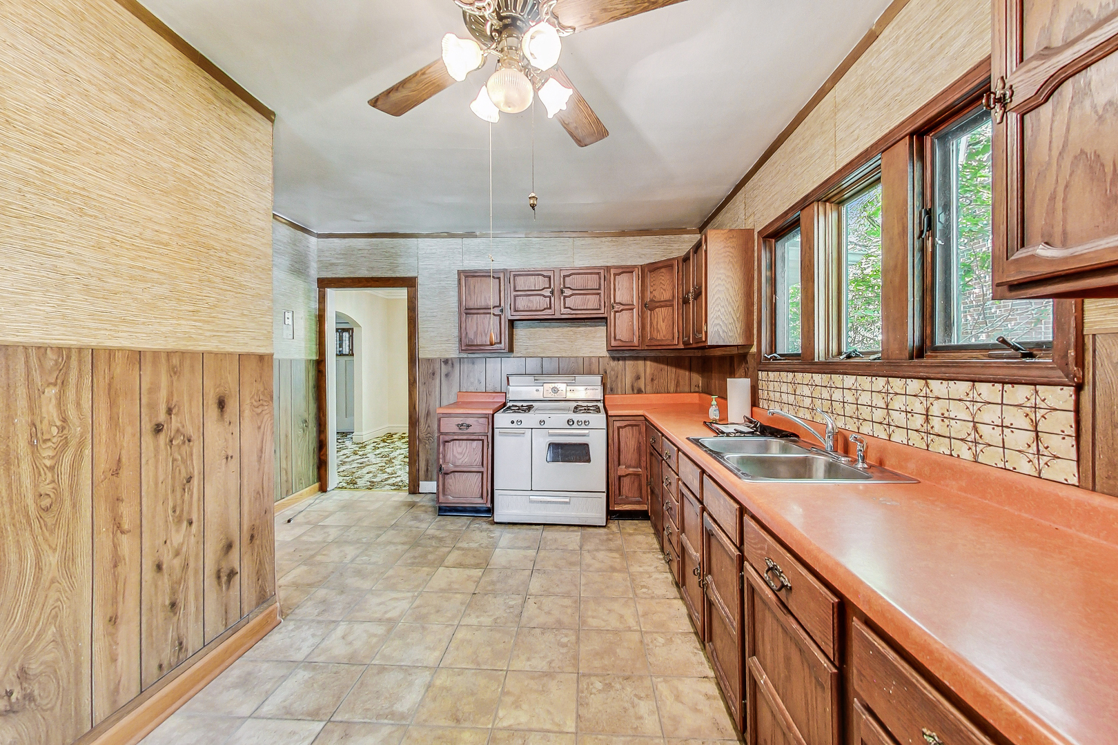 225 Herrick Road Riverside, IL 60546 - Photo 11 of 42 a kitchen with stainless steel appliances a sink and a stove