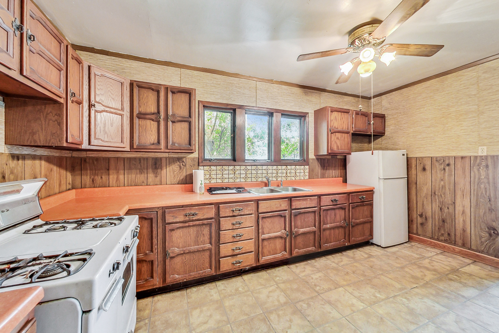 225 Herrick Road Riverside, IL 60546 - Photo 12 of 42 a kitchen with stainless steel appliances granite countertop a stove and a sink