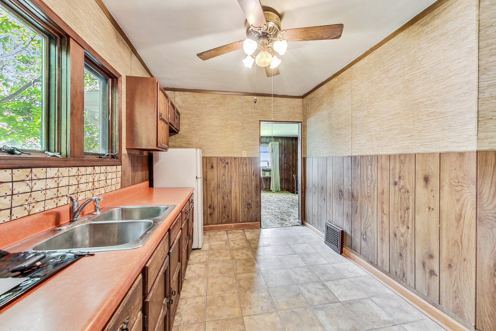 225 Herrick Road Riverside, IL 60546 - Photo 13 of 42 a kitchen that has a sink a counter top space and cabinets