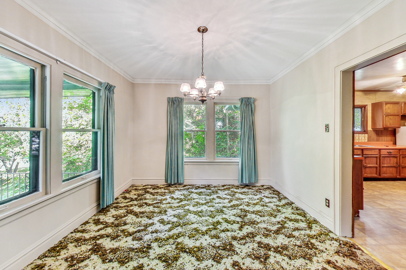 225 Herrick Road Riverside, IL 60546 - Photo 9 of 42 a front view of a bedroom with windows and chandelier