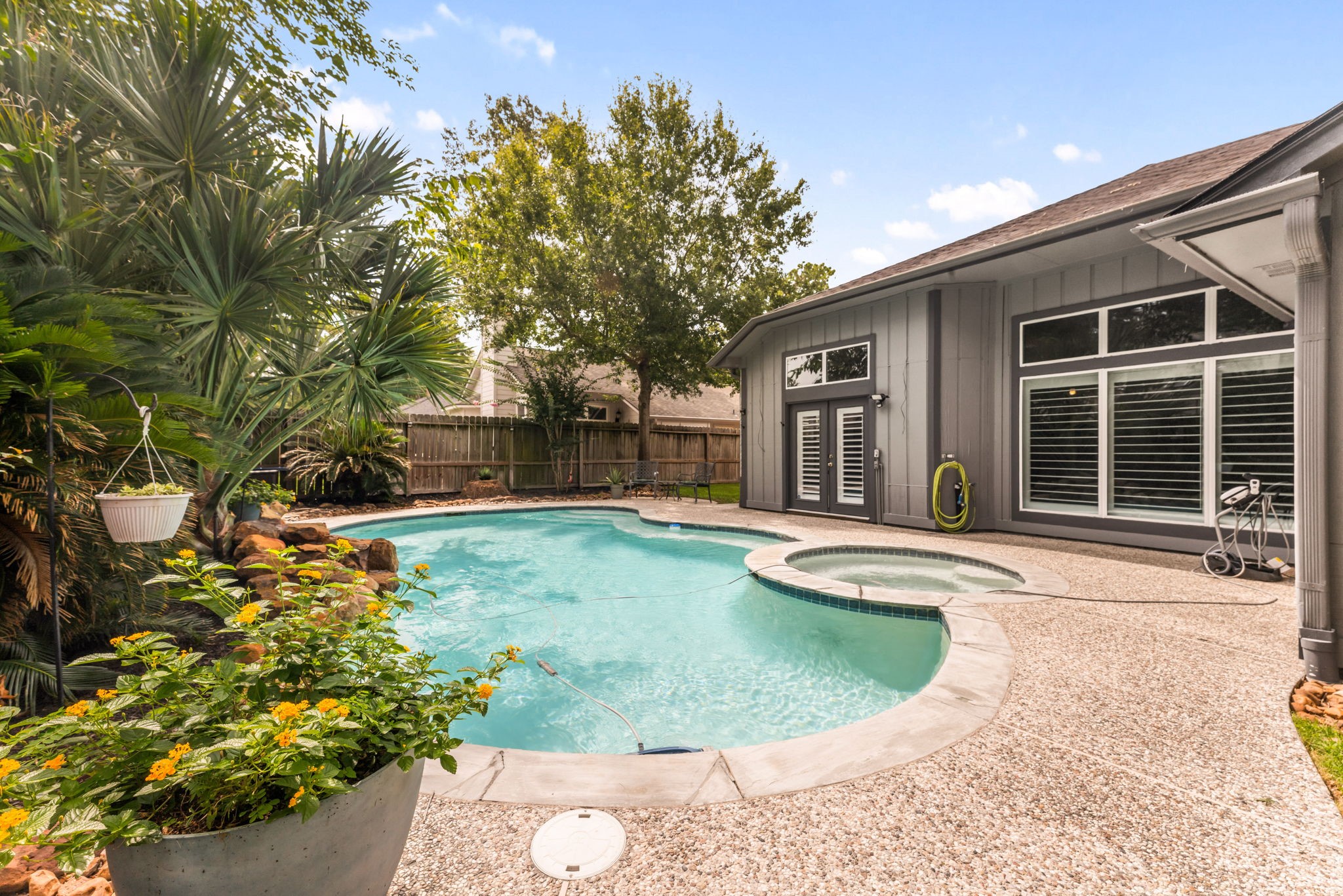 1915 Mercoal Drive Spring, TX 77386 - Photo 30 of 50 Private backyard retreat with an inviting pool, spacious patio, and room for outdoor entertaining.
