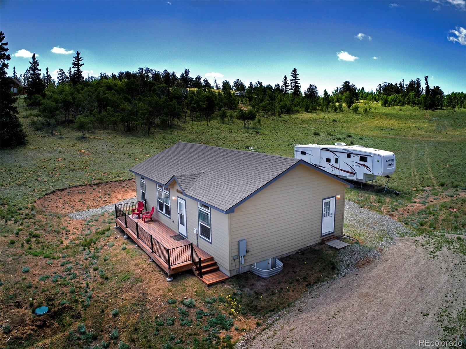 142 Long Rifle Way Como, CO 80432 - Photo 22 of 24 a aerial view of a house with big yard