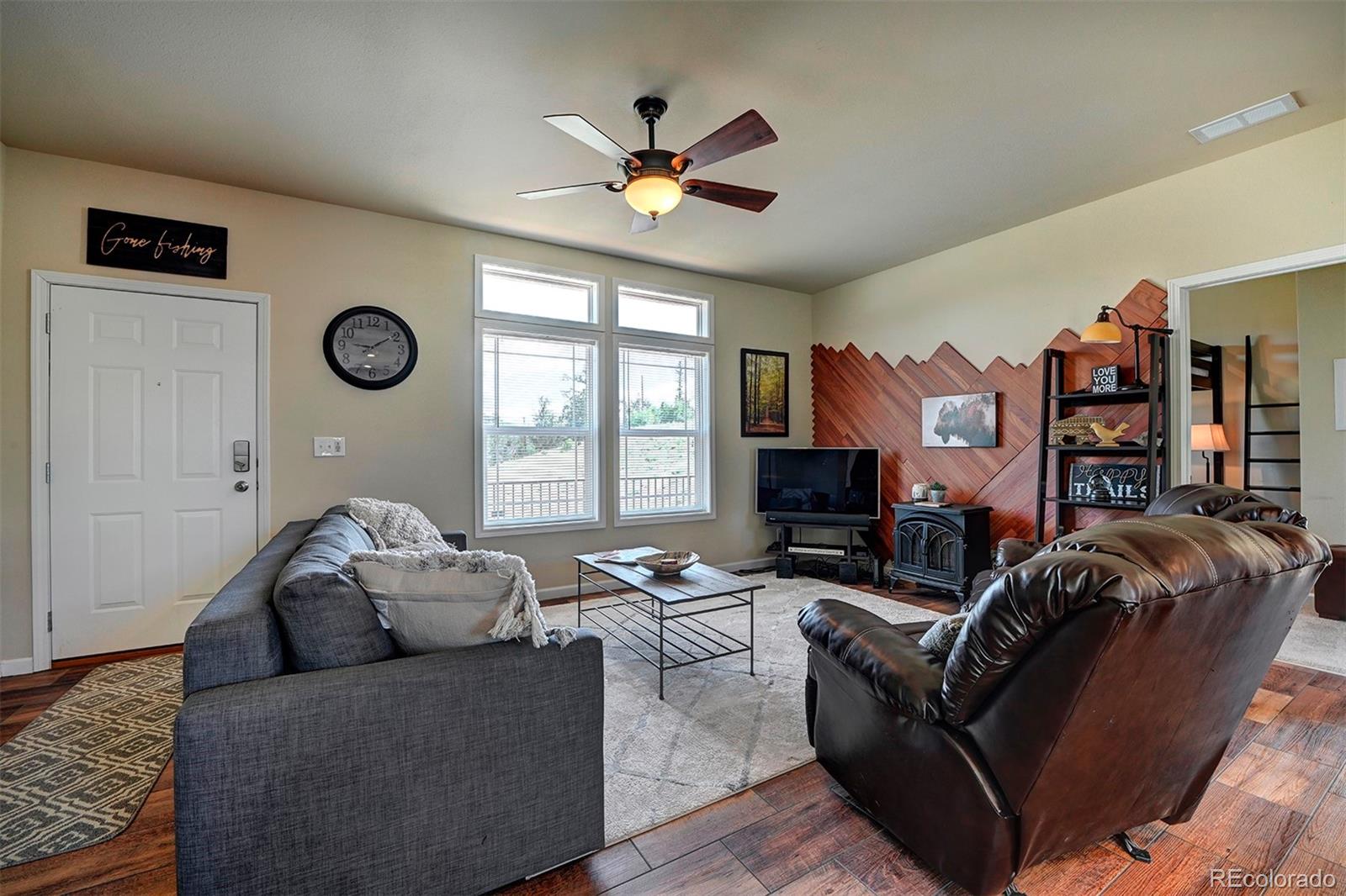 142 Long Rifle Way Como, CO 80432 - Photo 5 of 24 a living room with furniture and a fireplace