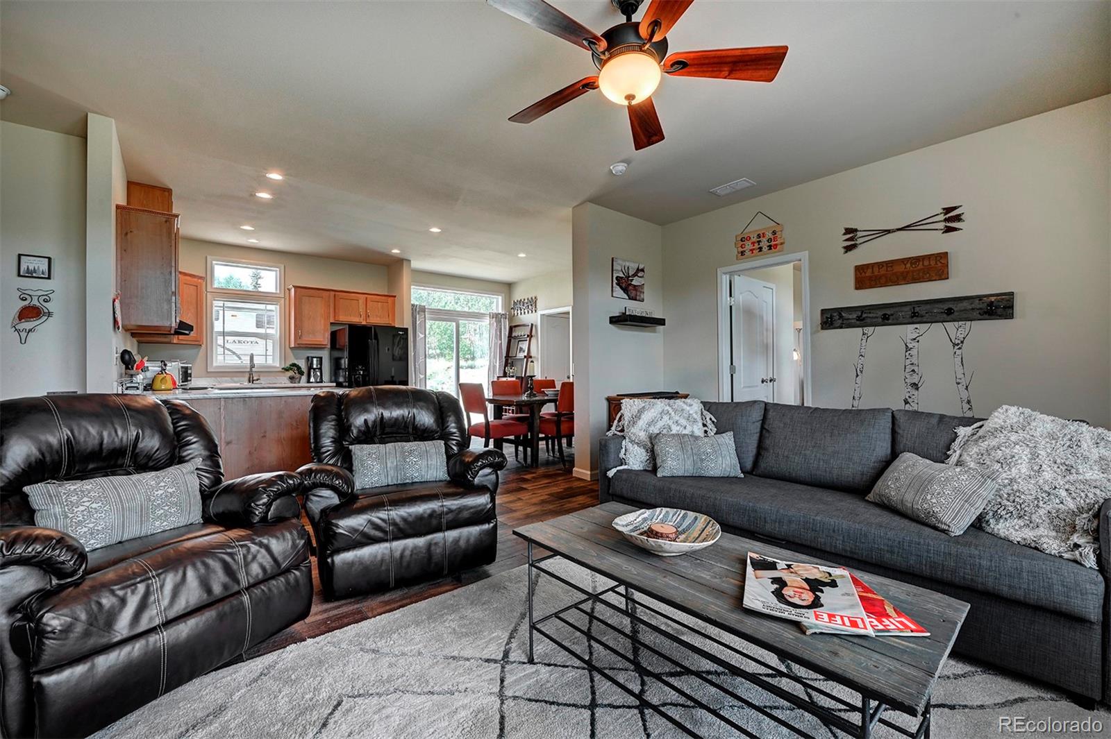 142 Long Rifle Way Como, CO 80432 - Photo 7 of 24 a living room with furniture and a ceiling fan