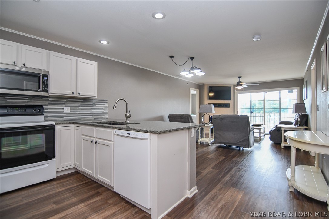 194 Sac Road, Unit D301 Sunrise Beach, MO 65079 - Photo 2 of 43 Kitchen to dining and living area