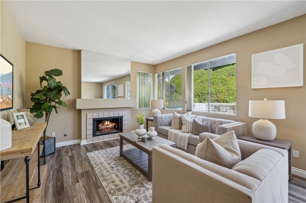 1 Suffolk Downs Laguna Niguel, CA 92677 - Photo 1 of 33 a living room with furniture and a fireplace