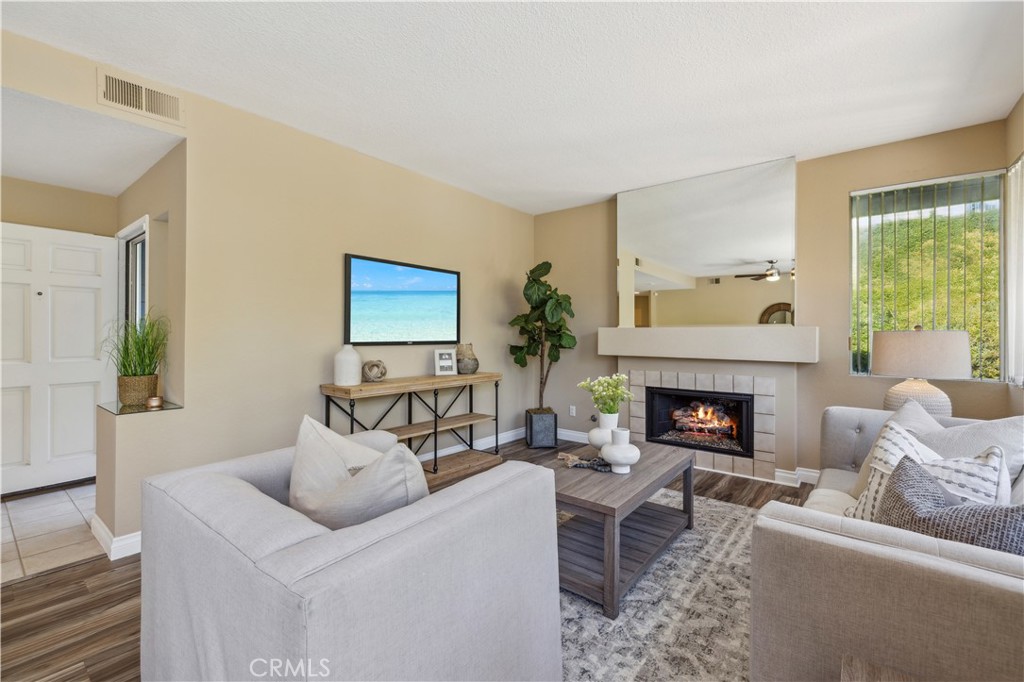 1 Suffolk Downs Laguna Niguel, CA 92677 - Photo 8 of 33 a living room with furniture and a fireplace