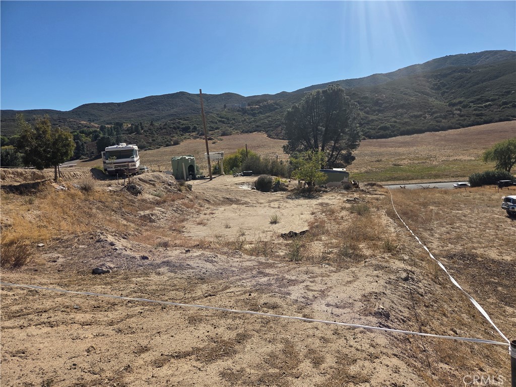 -vac Deer Bank Road Lake Elizabeth, CA 93532 - Photo 2 of 2 a view of a dry yard with mountains in the background