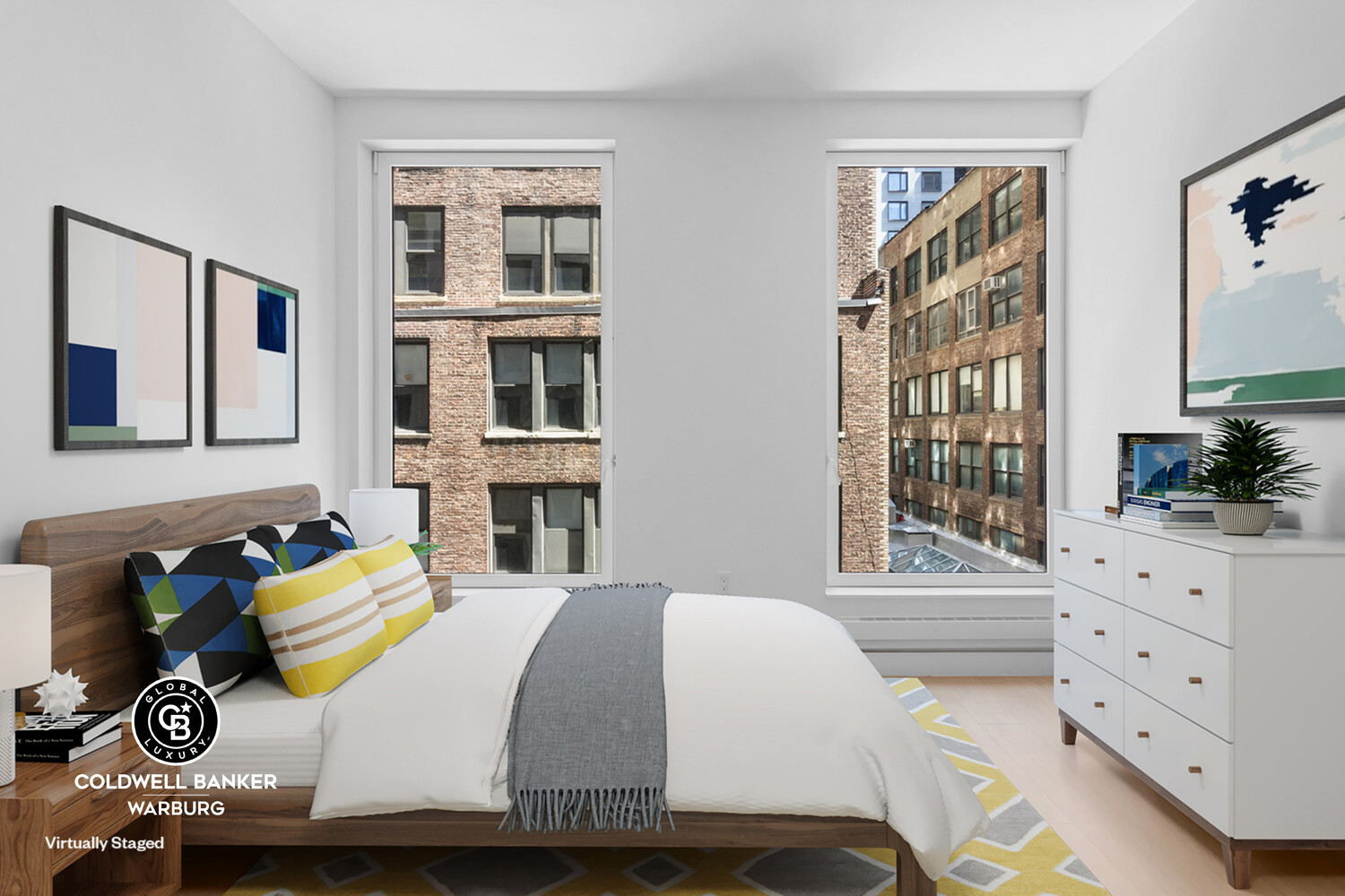 215 West 28th Street, Unit 7B Manhattan, NY 10001 - Photo 4 of 7 a bedroom with a bed and a window