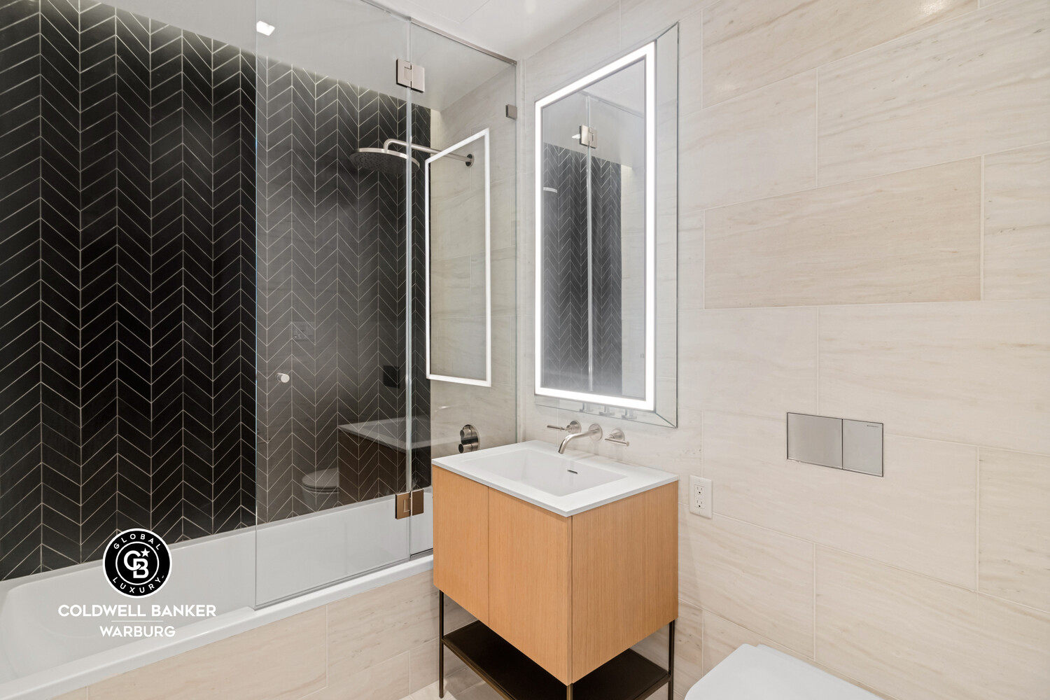 215 West 28th Street, Unit 7B Manhattan, NY 10001 - Photo 6 of 7 a bathroom with a bathtub and shower