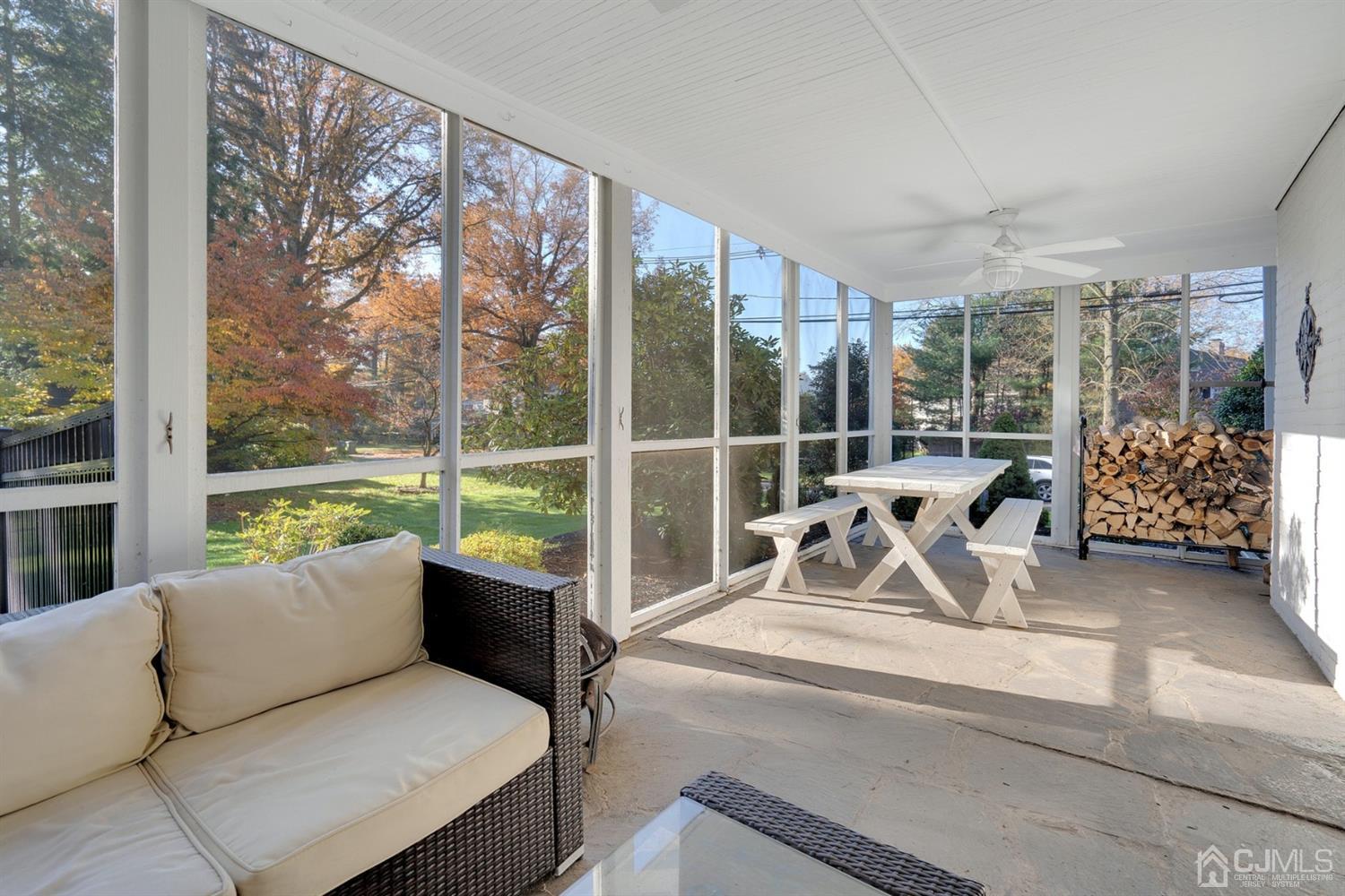 37 Oak Hills Road Edison, NJ 08820 - Photo 22 of 22 a living room with couch and a floor to ceiling window