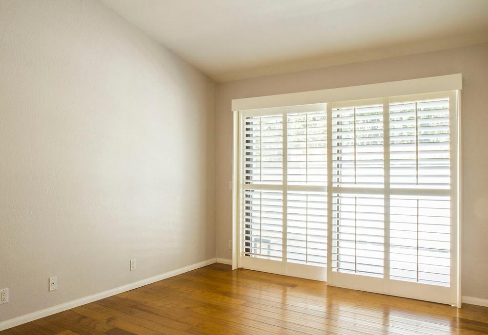 4042 Primavera Road, Unit 12 Santa Barbara, CA 93110 - Photo 14 of 21 wooden floor in an empty room with a window