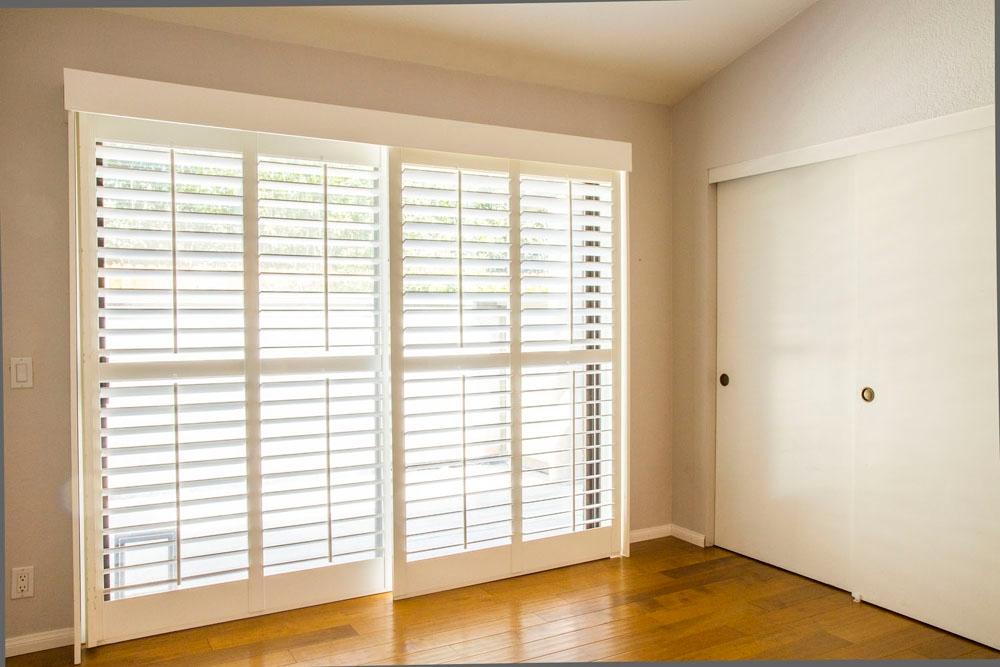 4042 Primavera Road, Unit 12 Santa Barbara, CA 93110 - Photo 15 of 21 a view of empty room with wooden floor and a window