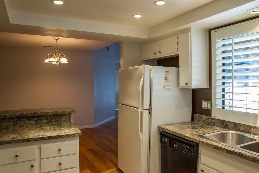 4042 Primavera Road, Unit 12 Santa Barbara, CA 93110 - Photo 6 of 21 a kitchen with a refrigerator and a sink