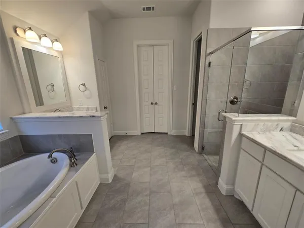 a bathroom with a double vanity sink mirror and double