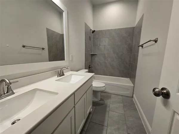 a bathroom with a sink toilet and vanity