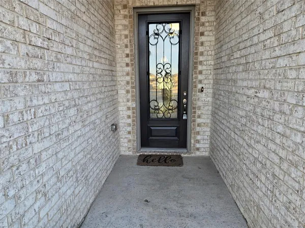 a view of gallery with wooden floor