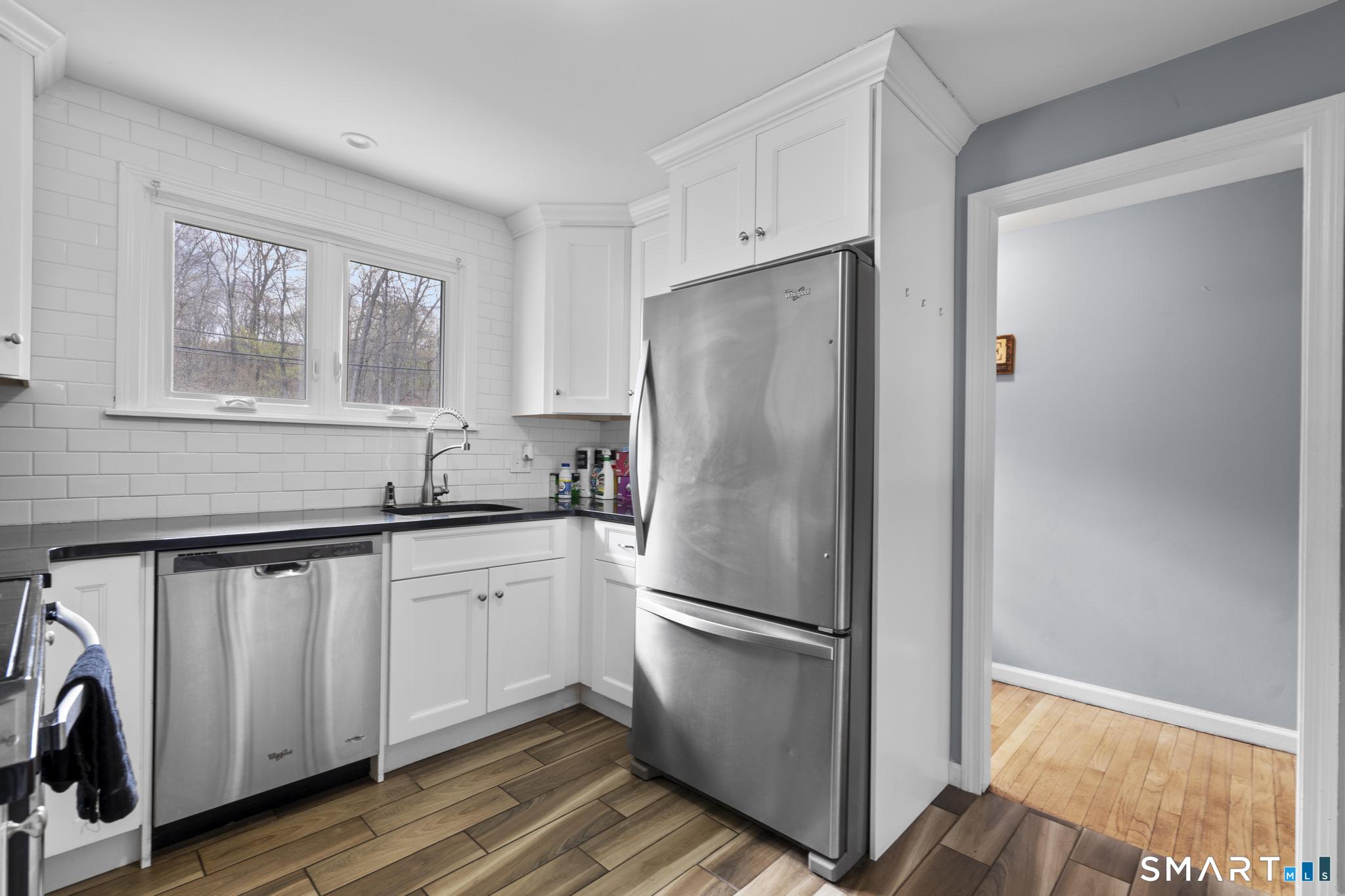 35 Fans Rock Road Hamden, CT 06518 - Photo 11 of 23 a white refrigerator freezer sitting inside of a kitchen