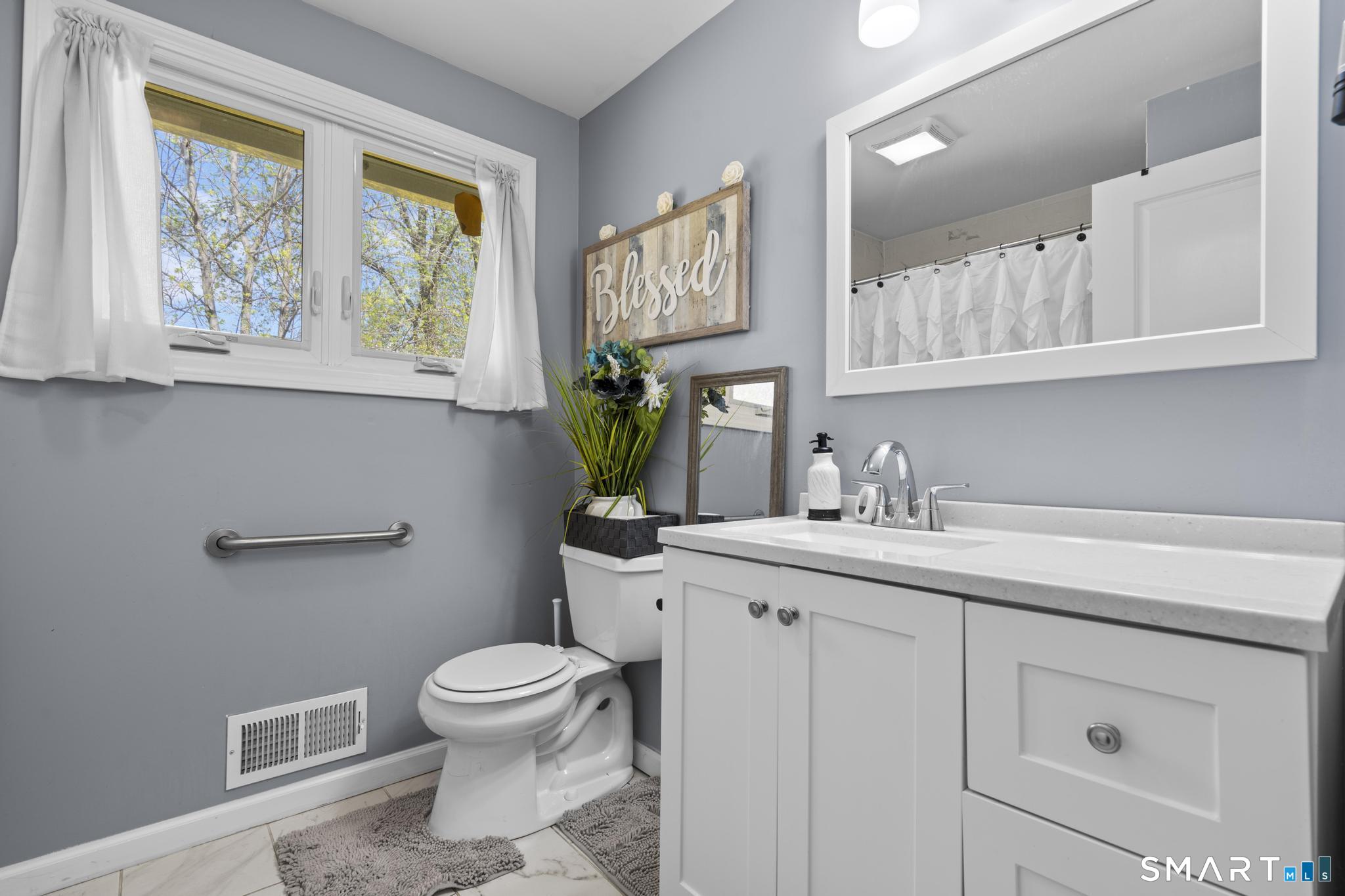 35 Fans Rock Road Hamden, CT 06518 - Photo 15 of 23 a bathroom with a toilet sink and mirror