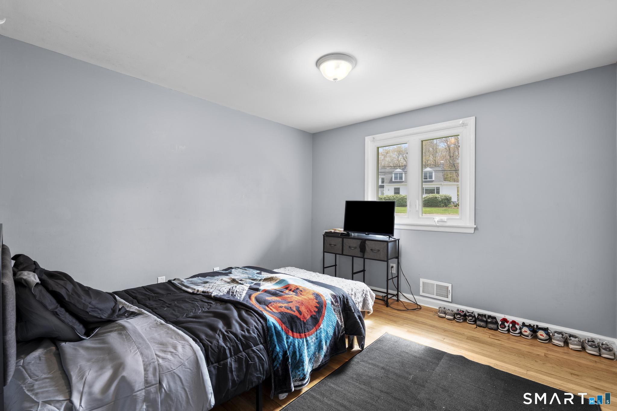 35 Fans Rock Road Hamden, CT 06518 - Photo 19 of 23 a bedroom with a bed and a window