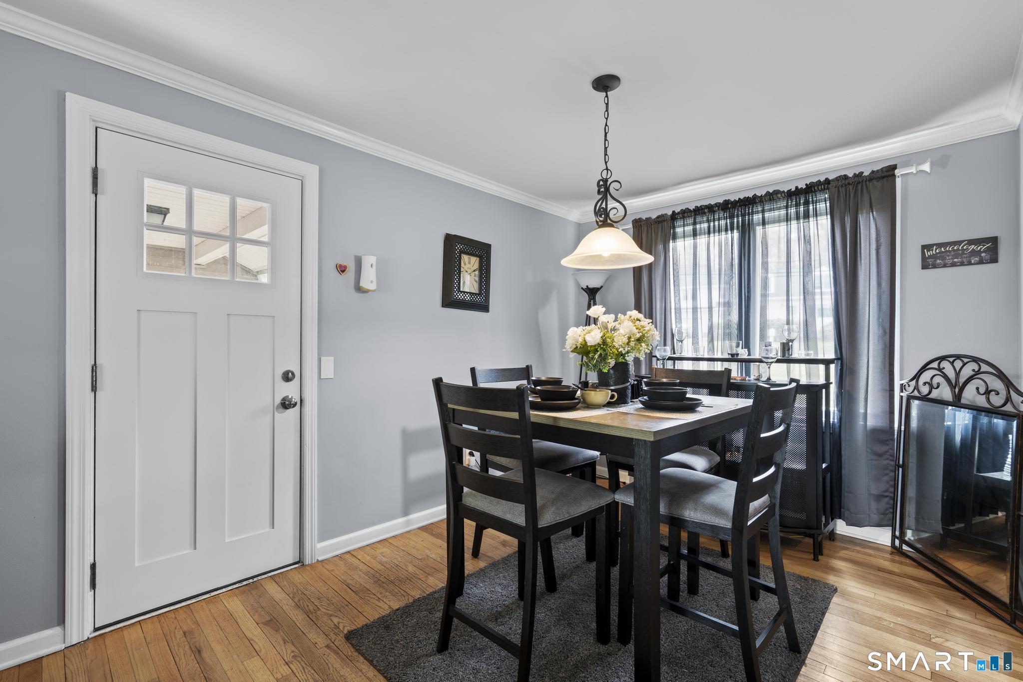 35 Fans Rock Road Hamden, CT 06518 - Photo 6 of 23 a view of a dining room with furniture window and wooden floor