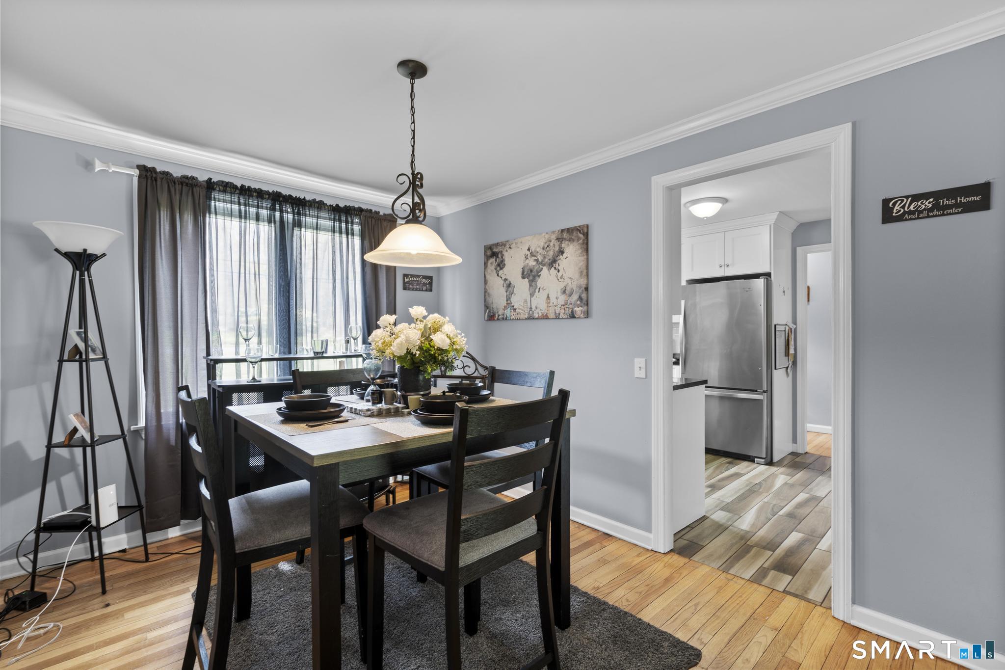 35 Fans Rock Road Hamden, CT 06518 - Photo 7 of 23 a view of a dining room with furniture window and wooden floor