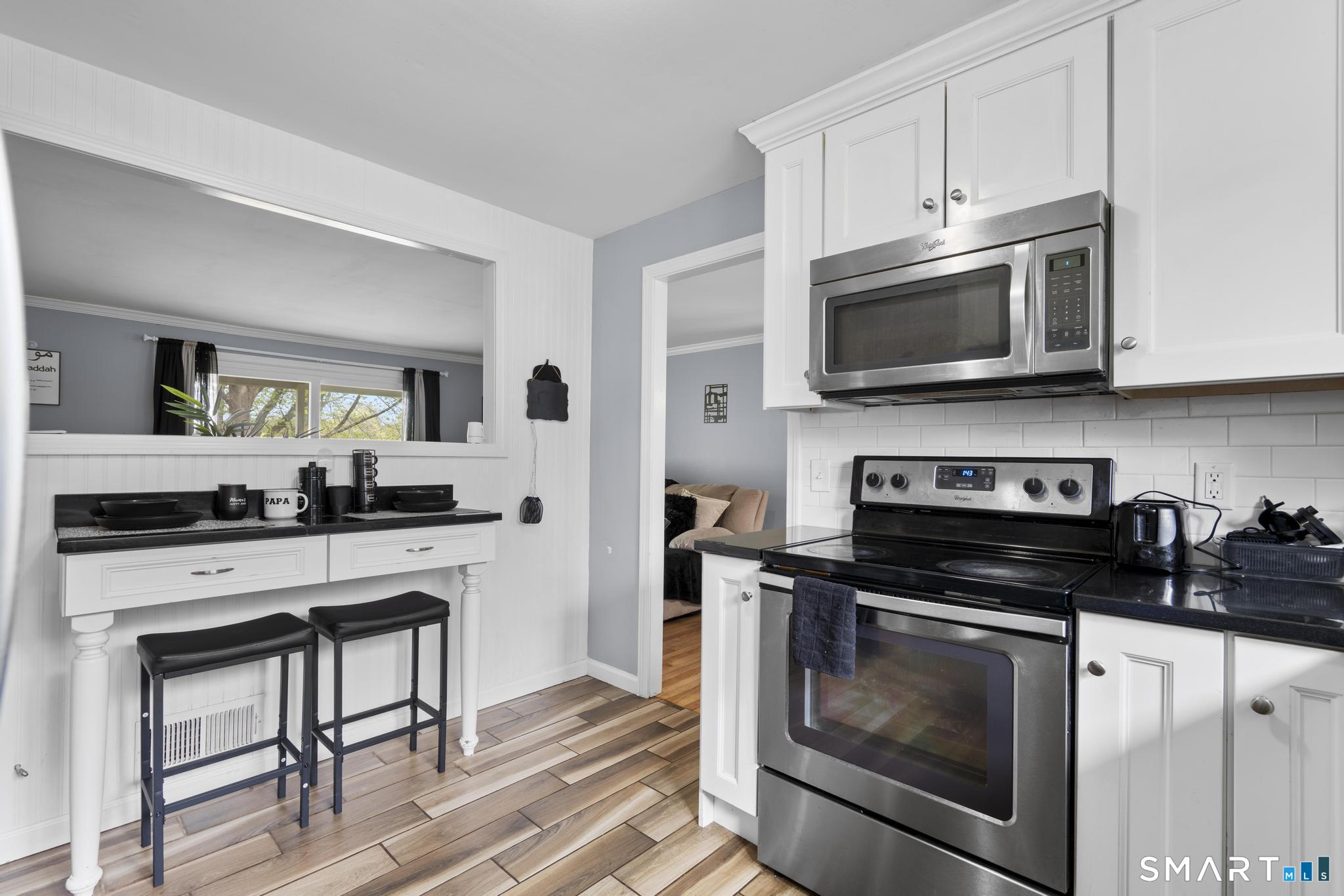35 Fans Rock Road Hamden, CT 06518 - Photo 9 of 23 a kitchen with cabinets stainless steel appliances a sink dishwasher and cabinets