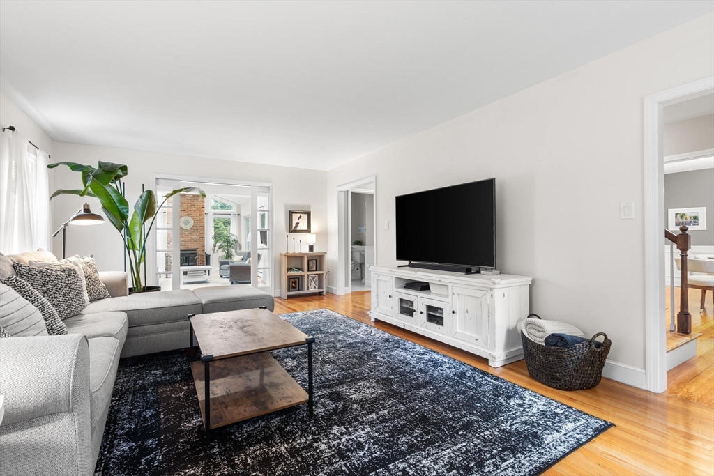 89 Haggetts Pond Road Andover, MA 01810 - Photo 16 of 42 a living room with furniture and a flat screen tv