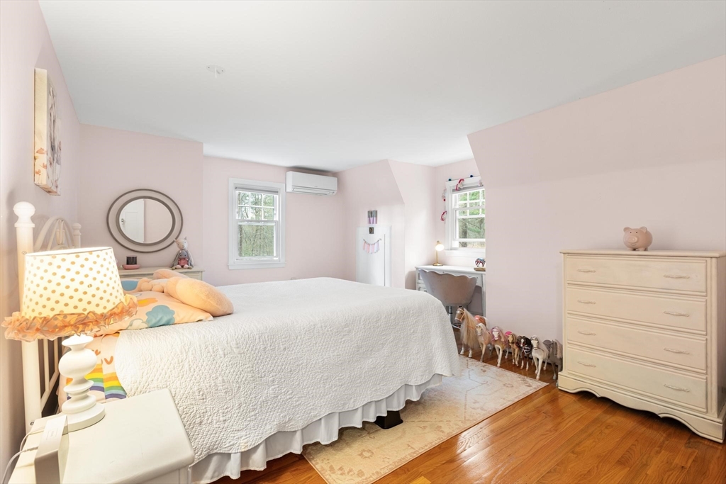 89 Haggetts Pond Road Andover, MA 01810 - Photo 23 of 42 a bedroom with a bed and wooden floor