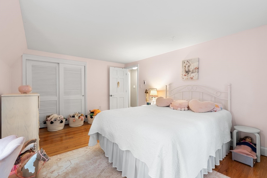 89 Haggetts Pond Road Andover, MA 01810 - Photo 24 of 42 a bedroom with a bed and a couch