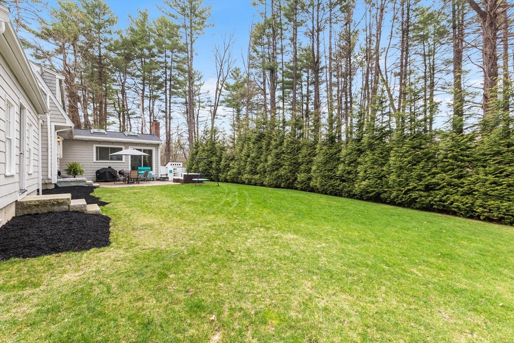 89 Haggetts Pond Road Andover, MA 01810 - Photo 39 of 42 a view of a yard in front of a house