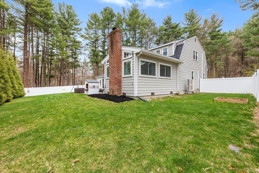 89 Haggetts Pond Road Andover, MA 01810 - Photo 40 of 42 a front view of house with yard and green space