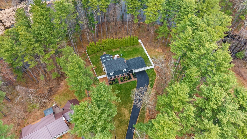 89 Haggetts Pond Road Andover, MA 01810 - Photo 41 of 42 an aerial view of a house with a yard