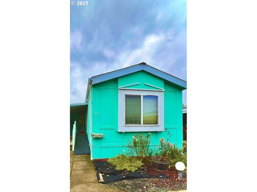 2150 Laura Street, Unit 221 Springfield, OR 97477 - Photo 1 of 16 a view of a backyard with a garden