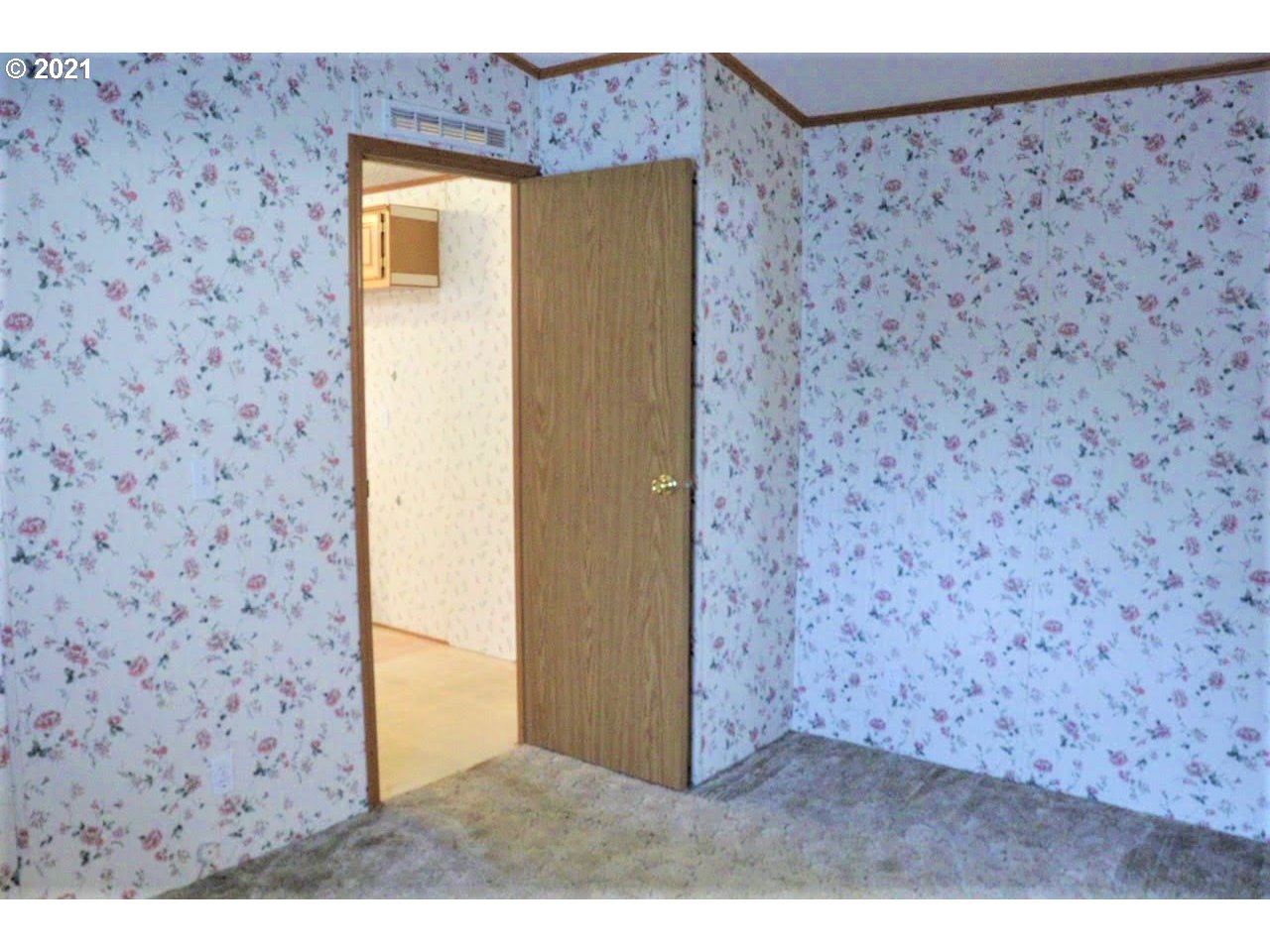 2150 Laura Street, Unit 221 Springfield, OR 97477 - Photo 11 of 16 a view of a wooden door
