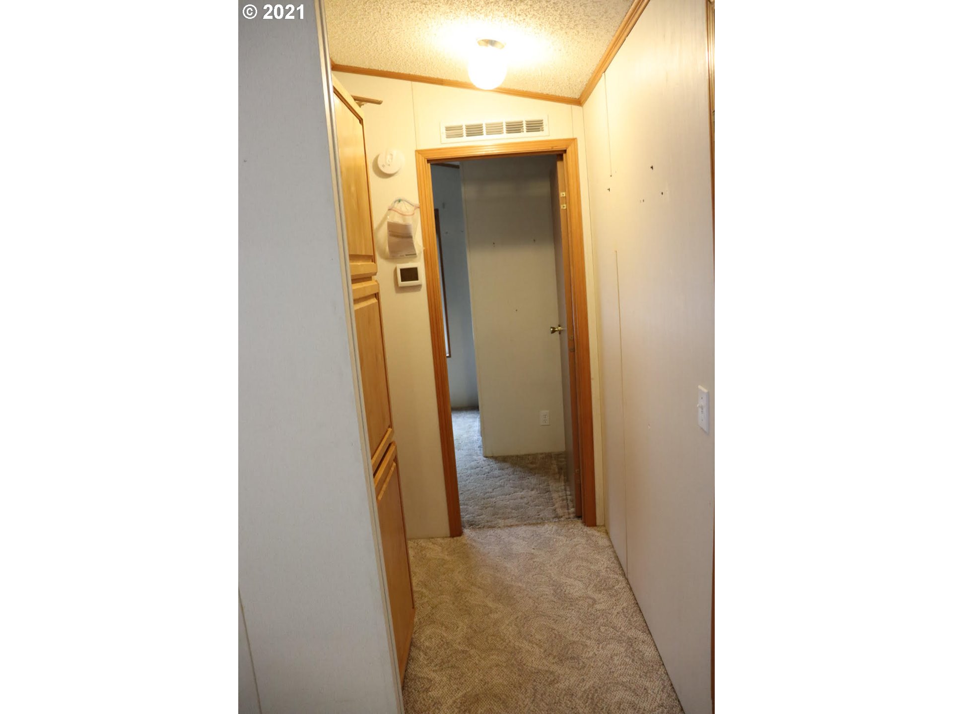 2150 Laura Street, Unit 221 Springfield, OR 97477 - Photo 16 of 16 a view of a bathroom from a hallway