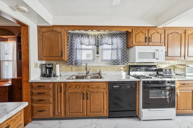 a kitchen with a refrigerator and a sink