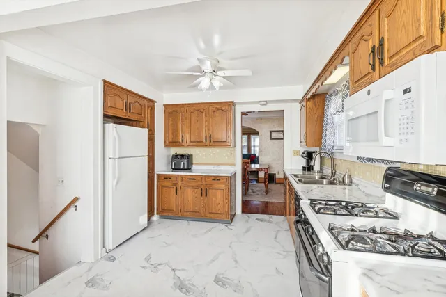 a bedroom with a bed wooden floor and window