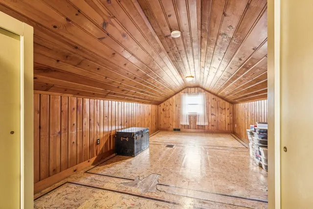 a view of a hall with wooden floor