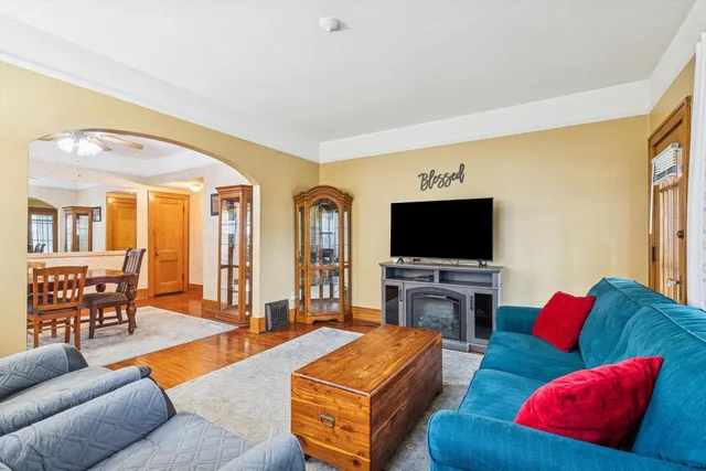 a living room with furniture and a flat screen tv