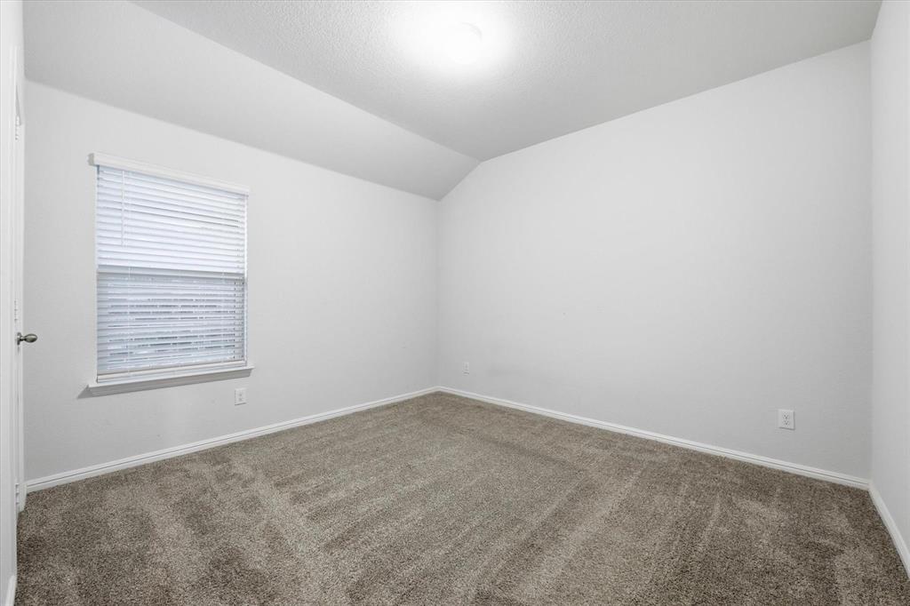 9308 Desertrock Road Fort Worth, TX 76131 - Photo 19 of 29 an empty room with a window