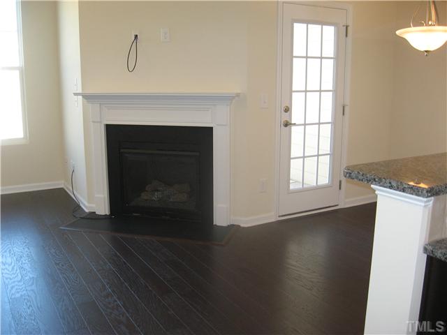 9134 Falkwood Road, Unit 175 Raleigh, NC 27617 - Photo 3 of 14 Fireplace and hardwoods on entire 2nd floor.