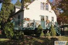 164 Jordan Road Colonia, NJ 07067 - Photo 2 of 8 a view of a balcony with plants and trees