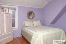 164 Jordan Road Colonia, NJ 07067 - Photo 6 of 8 a bedroom with a bed and a window