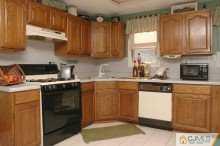 164 Jordan Road Colonia, NJ 07067 - Photo 8 of 8 a kitchen with stainless steel appliances granite countertop a stove a sink and a microwave