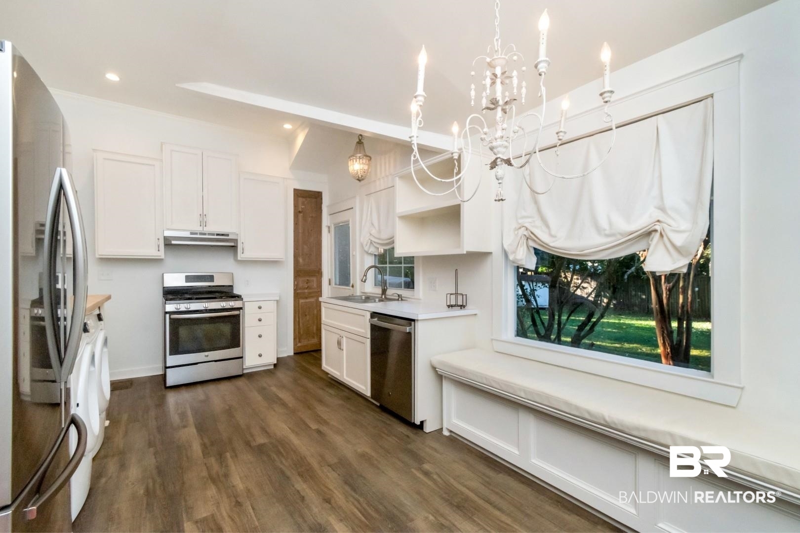16 Princess Anne Road Mobile, AL 36608 - Photo 12 of 40 Kitchen with stainless steel appliances, white cabinetry, light countertops, open shelves, and recessed lighting