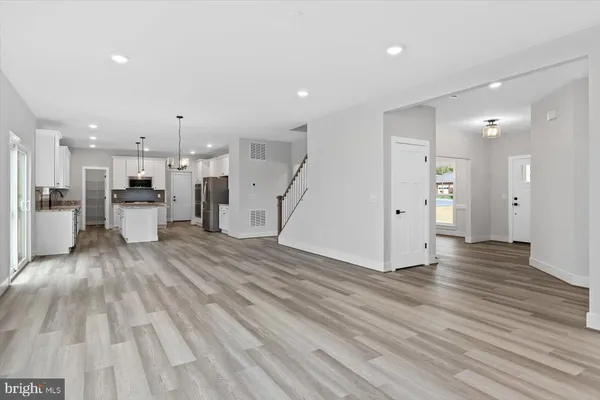 a view of a living room with a wooden floor