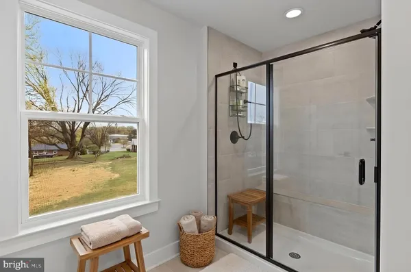 a bathroom with a shower and a window