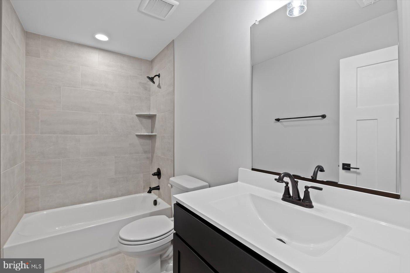 0 Stevensburg Road Culpeper, VA 22701 - Photo 32 of 42 a bathroom with a sink a toilet and a large mirror