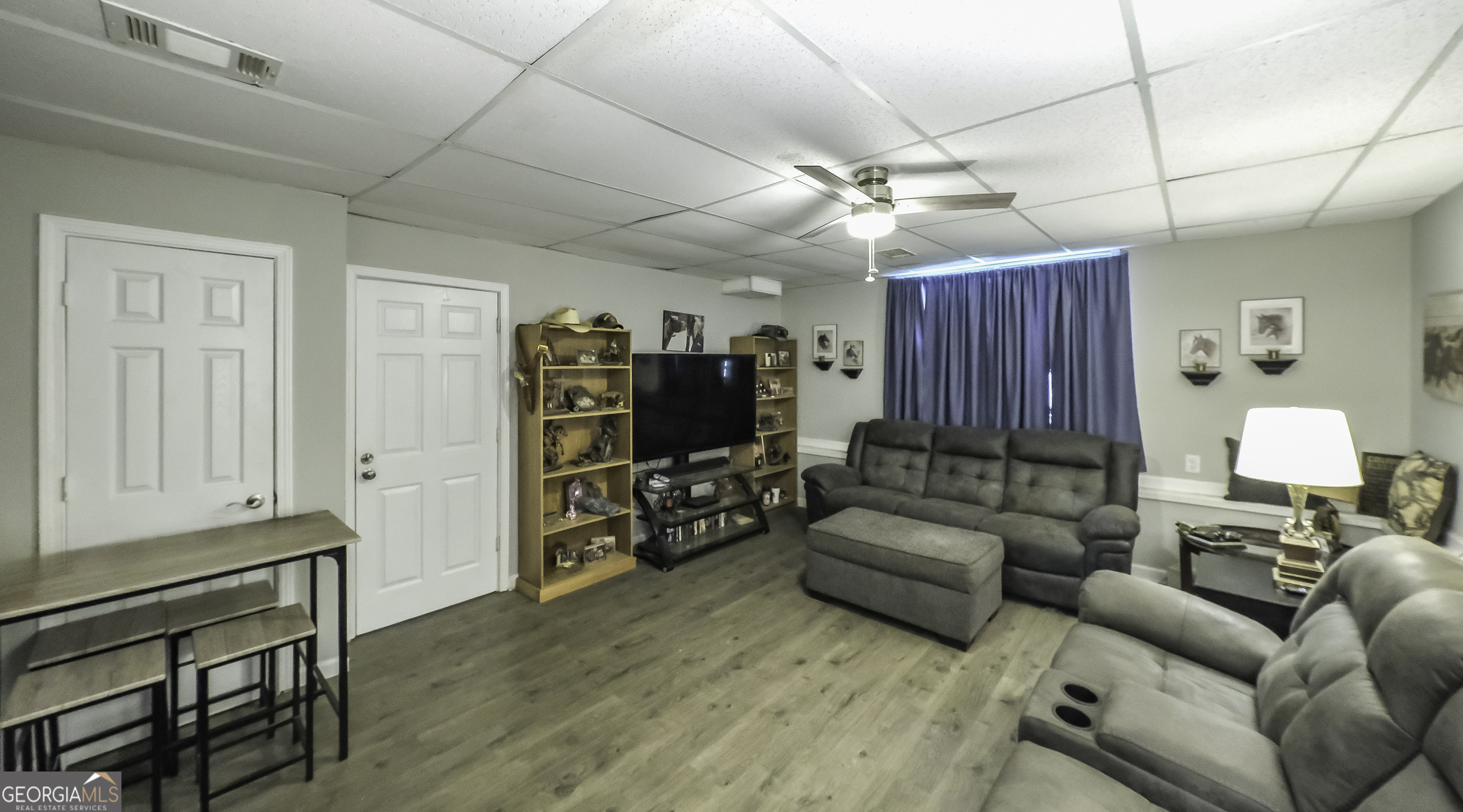 85 Taylors Gin Road Temple, GA 30179 - Photo 11 of 45 a living room with furniture and a flat screen tv